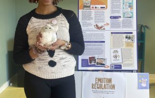 Ayan, a member of our young persons advisory group, holding a Purrble