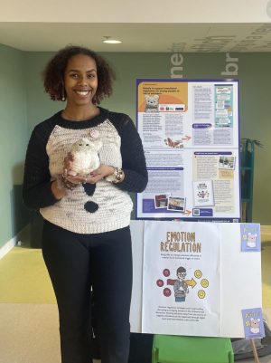 Ayan, a member of our young persons advisory group, holding a Purrble